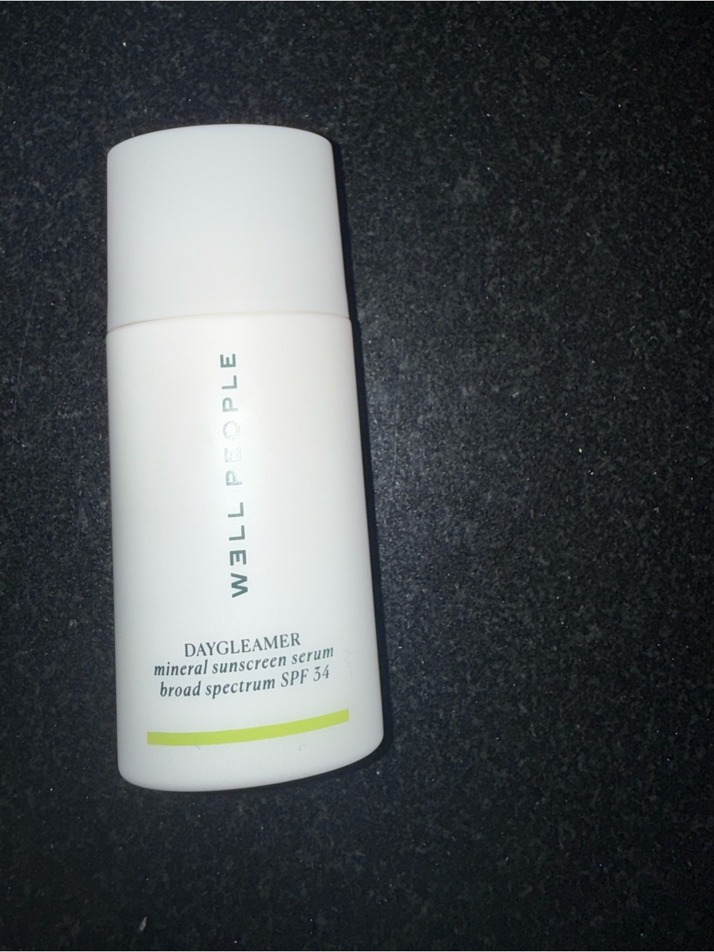 W3ll People Daygleamer Mineral Sunscreen Serum - White with Lime Accent.